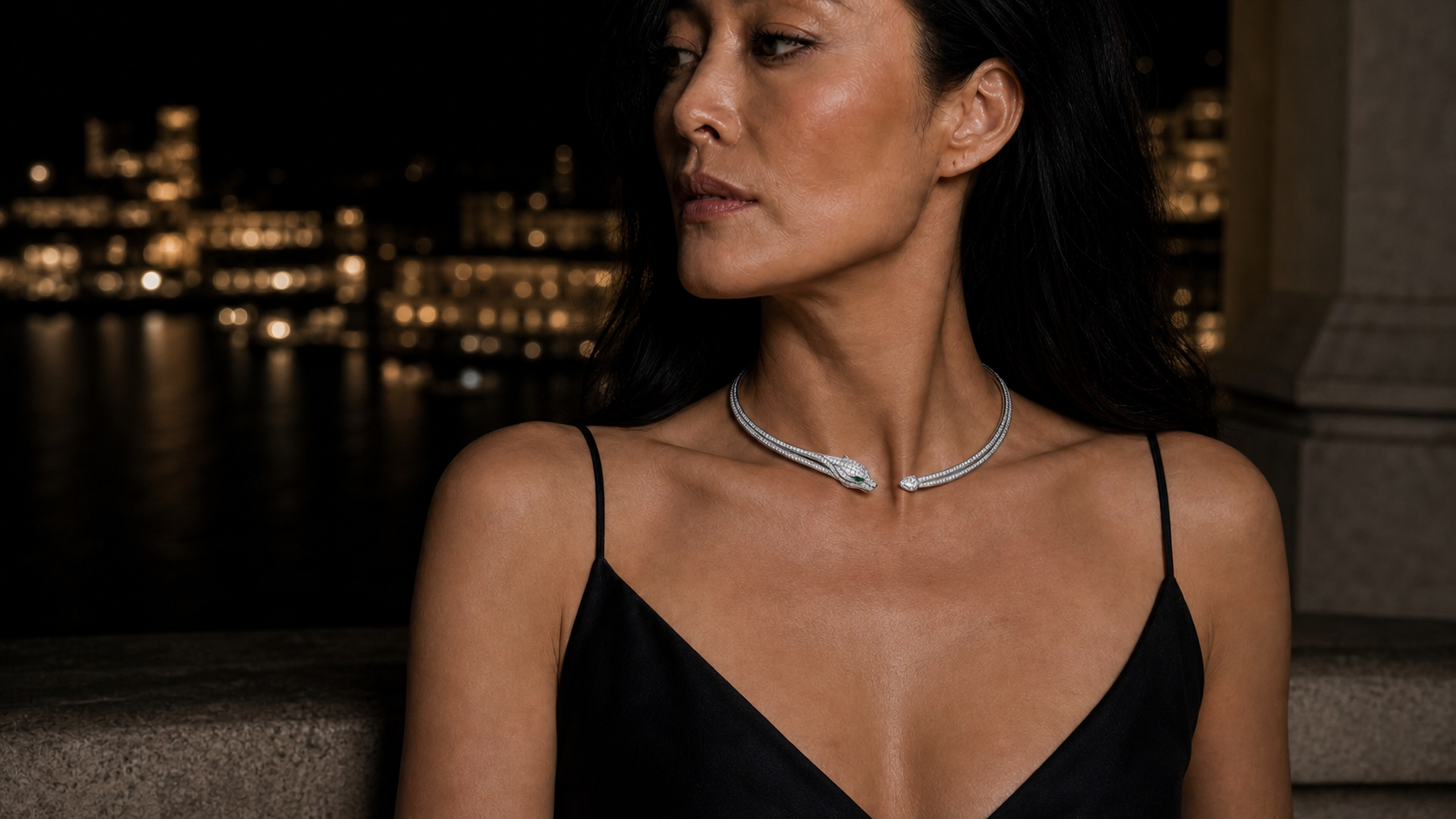 The Trace Collar worn at the base of the throat, its fine white-gold line closing on a small pavé panther head.