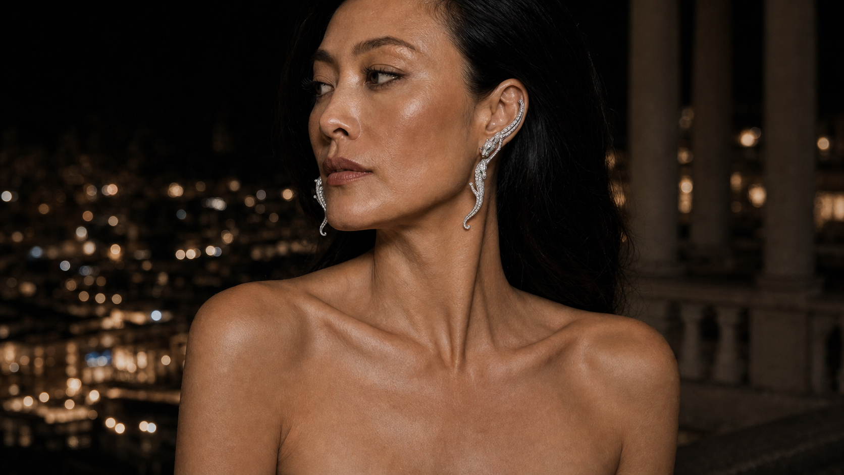 The Nocturne Ear Climbers worn along the ear, the articulated white-gold panther rising in diamond pavé.